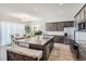 Modern kitchen with granite countertops and dark cabinetry at 16122 Emporia Way, Brighton, CO 80602