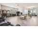 Open concept living room and dining area with hardwood floors at 16122 Emporia Way, Brighton, CO 80602