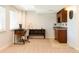 Finished basement with desk area and mini bar, perfect for entertaining or working from home at 2214 E 101St Ave, Thornton, CO 80229