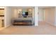 Finished basement featuring a built-in entertainment center and open living space for relaxation and recreation at 2214 E 101St Ave, Thornton, CO 80229