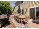 Outdoor deck with dining table, chairs, BBQ, and space to gather at 2214 E 101St Ave, Thornton, CO 80229