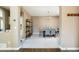 Spacious dining room area with stylish light fixture, seating for six, and open layout at 2214 E 101St Ave, Thornton, CO 80229