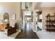 Welcoming foyer with hardwood floors and a view of the staircase and living spaces at 2214 E 101St Ave, Thornton, CO 80229
