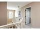Bright hallway with a white banister leading to bedrooms and a neutral color scheme at 2214 E 101St Ave, Thornton, CO 80229