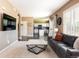 Open-concept living room with a view of the kitchen and a comfortable seating area at 2214 E 101St Ave, Thornton, CO 80229