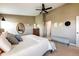 Relaxing main bedroom with stylish decor, ceiling fan, and neutral tones creating a calming retreat at 2214 E 101St Ave, Thornton, CO 80229