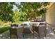 Backyard patio with a built-in fire pit, seating, and outdoor entertainment space at 2214 E 101St Ave, Thornton, CO 80229
