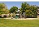 Neighborhood playground features a jungle gym with swings and slides at 2214 E 101St Ave, Thornton, CO 80229