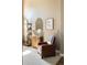 Cozy sitting area with a leather armchair, stylish shelving, and modern decor at 2214 E 101St Ave, Thornton, CO 80229