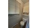 Enclosed toilet stall with a window for natural light at 11306 E Colorado Dr, Aurora, CO 80012
