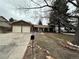 Charming brick ranch home with a two-car garage and covered front porch at 11306 E Colorado Dr, Aurora, CO 80012