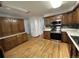 Kitchen featuring wood cabinets, stainless steel appliances, and laminate countertops at 11306 E Colorado Dr, Aurora, CO 80012
