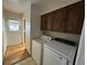Utility area with laundry equipment and access to the exterior at 11306 E Colorado Dr, Aurora, CO 80012