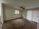 Living room with neutral carpet, natural light and a ceiling fan at 11306 E Colorado Dr, Aurora, CO 80012