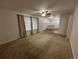Inviting living room with natural lighting, neutral walls and carpet at 11306 E Colorado Dr, Aurora, CO 80012
