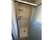 Shower stall with a sliding door and built-in shelving at 11306 E Colorado Dr, Aurora, CO 80012