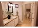 Double vanity bathroom with granite countertop, and separate toilet area at 1444 Willow Oak Rd, Castle Rock, CO 80104