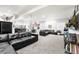 Large finished basement with comfy sofas and a dedicated games/entertaining area at 2404 Horse Shoe Cir, Fort Lupton, CO 80621