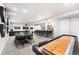Spacious finished basement features a home bar, games and TV area at 2404 Horse Shoe Cir, Fort Lupton, CO 80621