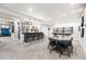 Spacious finished basement with a home bar, pool table, and dining area at 2404 Horse Shoe Cir, Fort Lupton, CO 80621