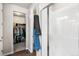 Clean bathroom with a shower and closet offering ample storage space at 2404 Horse Shoe Cir, Fort Lupton, CO 80621