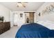 Bright bedroom featuring a walk-in closet and warm, inviting decor at 2404 Horse Shoe Cir, Fort Lupton, CO 80621