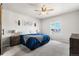 Relaxing bedroom with a ceiling fan and ample natural light from the window at 2404 Horse Shoe Cir, Fort Lupton, CO 80621