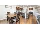 Stylish eat-in kitchen with stainless steel appliances and a dark wood table for gathering at 2404 Horse Shoe Cir, Fort Lupton, CO 80621