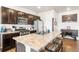 Inviting eat-in kitchen featuring a large island and a range of modern appliances at 2404 Horse Shoe Cir, Fort Lupton, CO 80621