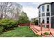 A lush backyard with an expansive deck offers a serene outdoor space and well-maintained greenery at 674 Huntington Dr, Highlands Ranch, CO 80126