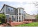 Beautiful backyard featuring an expansive deck, well-manicured lawn, and stylish exterior elevation at 674 Huntington Dr, Highlands Ranch, CO 80126