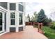 Spacious wooden deck with stylish railings, offering an inviting outdoor living space and large windows at 674 Huntington Dr, Highlands Ranch, CO 80126