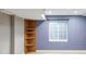 Finished basement featuring a corner bookshelf and a window bringing natural light to the space at 674 Huntington Dr, Highlands Ranch, CO 80126