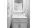 Elegant bathroom featuring a vanity with a light gray cabinet, white countertop, and decorative mirror at 674 Huntington Dr, Highlands Ranch, CO 80126