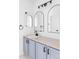 Modern bathroom featuring dual arch mirrors, shaker cabinets, and sleek fixtures at 674 Huntington Dr, Highlands Ranch, CO 80126