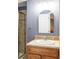 Bathroom features a sink, a glass shower door, and a neutral-colored shower at 674 Huntington Dr, Highlands Ranch, CO 80126