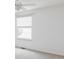 Bright bedroom features neutral walls, a fan, and a window for ample natural light at 674 Huntington Dr, Highlands Ranch, CO 80126