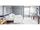 Bright bedroom with a modern four-poster bed, stylish décor, and a view from the window at 674 Huntington Dr, Highlands Ranch, CO 80126