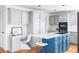 Bright kitchen with a large island, stainless steel appliances, and hardwood flooring at 674 Huntington Dr, Highlands Ranch, CO 80126