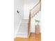 Elegant staircase featuring hardwood railings and carpeted steps leading to the upper level at 674 Huntington Dr, Highlands Ranch, CO 80126