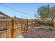 View of fenced backyard featuring mulch and wood fence, great for outdoor enjoyment and privacy at 1087 Wolff St, Denver, CO 80204