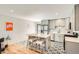 Modern kitchen with stainless steel appliances, gray cabinets, and a stylish island with seating at 1087 Wolff St, Denver, CO 80204