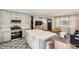 Modern kitchen with stainless steel appliances, island, and decorative tile floor at 1087 Wolff St, Denver, CO 80204