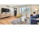 Bright living room with hardwood floors, stylish furniture, and a welcoming atmosphere at 1087 Wolff St, Denver, CO 80204