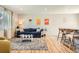 Inviting living room featuring stylish decor, a comfortable sofa, and an open layout to the kitchen at 1087 Wolff St, Denver, CO 80204