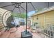 Backyard featuring a patio area with an umbrella, grill, egg chair, and outdoor decor at 15612 E 96Th Way # 29A, Commerce City, CO 80022