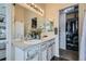 Bathroom with double sinks, bright lighting, and a separate shower at 15612 E 96Th Way # 29A, Commerce City, CO 80022