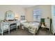 Cozy bedroom with a charming vanity, bright window, and neutral color scheme at 15612 E 96Th Way # 29A, Commerce City, CO 80022