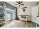 Bright dining area with sliding glass door access to the outdoor patio and a table at 15612 E 96Th Way # 29A, Commerce City, CO 80022
