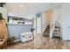 Open entryway leading to the kitchen and staircase, creating a seamless flow throughout the home at 15612 E 96Th Way # 29A, Commerce City, CO 80022